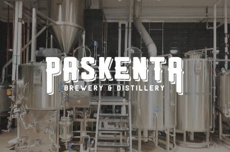Brewery backdrop with Paskenta Brewery & Distillery logo