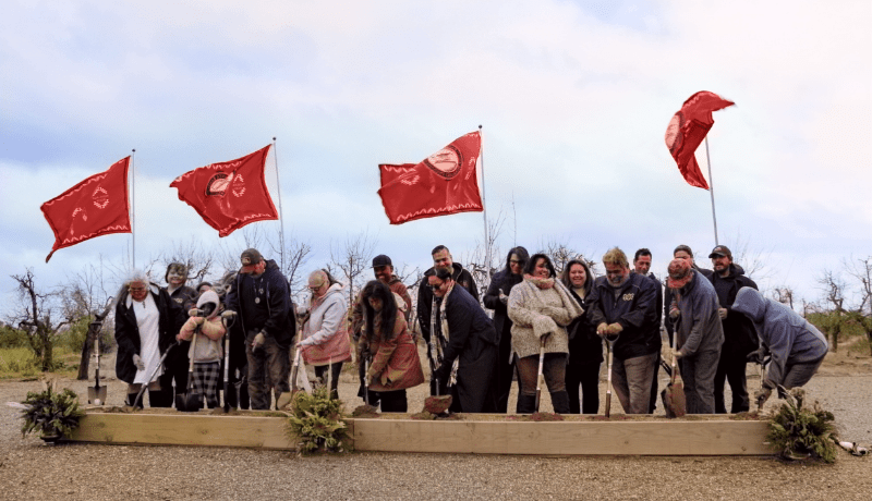 Ceremony with many people and flags